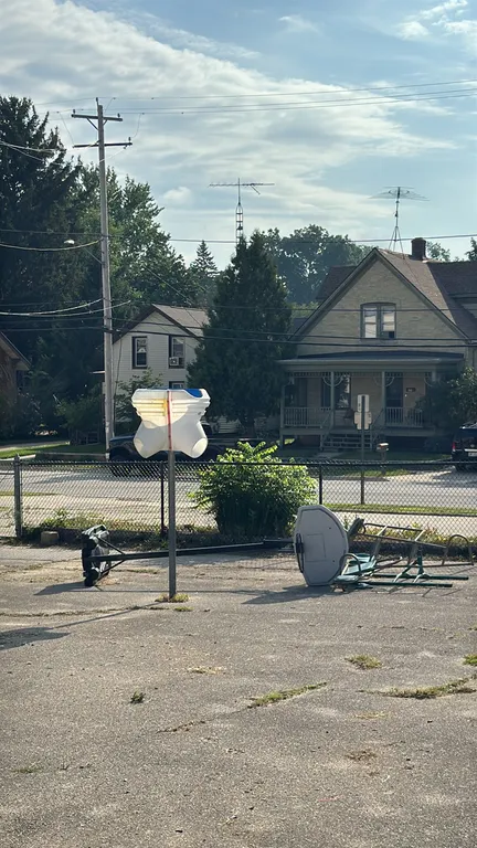 Portable basketball hoop system. Features a molded plastic backboard, metal pole, and a fillable plastic base with wheels. Note: System is currently t