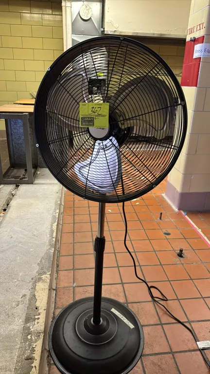 Hurricane 20" pedestal fan. Features a 3-blade metal fan assembly, black wire safety grill, and adjustable height pole. 20" diameter. Mounted on a rou