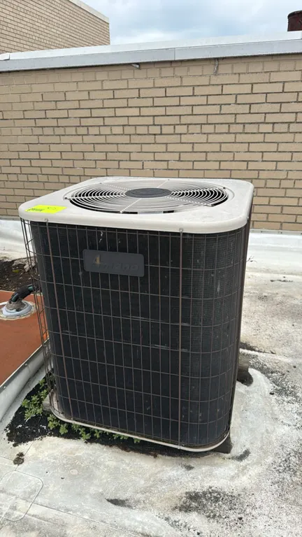 Amana RCB48B2A central cooling outdoor condenser unit. Factory charged with 112 oz of R22 refrigerant. S/N: 9902195492. Electrical: 208/230V, 60 Hz, 1