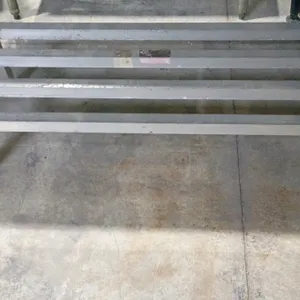 Metal dunnage rack. Features a slatted design with square tubular metal construction. Dimensions: 48"L x 18"W x 12"H.