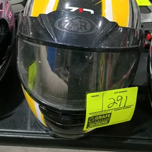 Z1R full-face helmet. Features an integrated clear visor, chin ventilation, and a graphic pattern in yellow, black, white, and gray.