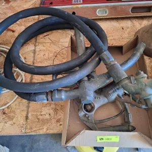 Vintage Gas Pump Nozzles with Hose