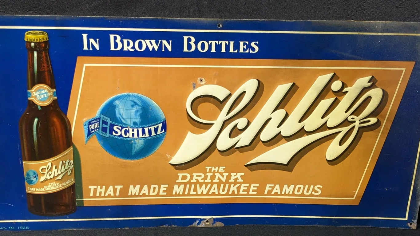 EMBOSSED TIN SCHLITZ PROHIBITION SIGN IN BROWN BOTTLES THE DRINK THAT MADE MILWAUKEE FAMOUS