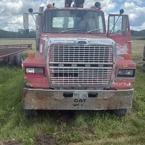 1986 Ford Louisville, 12,000 lbs picker in the back