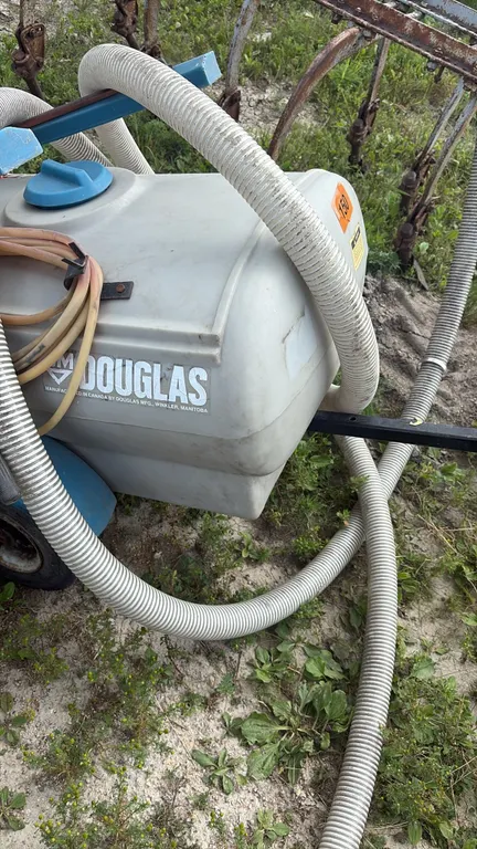 12 V Douglas pull behind sprayer ,sold as is