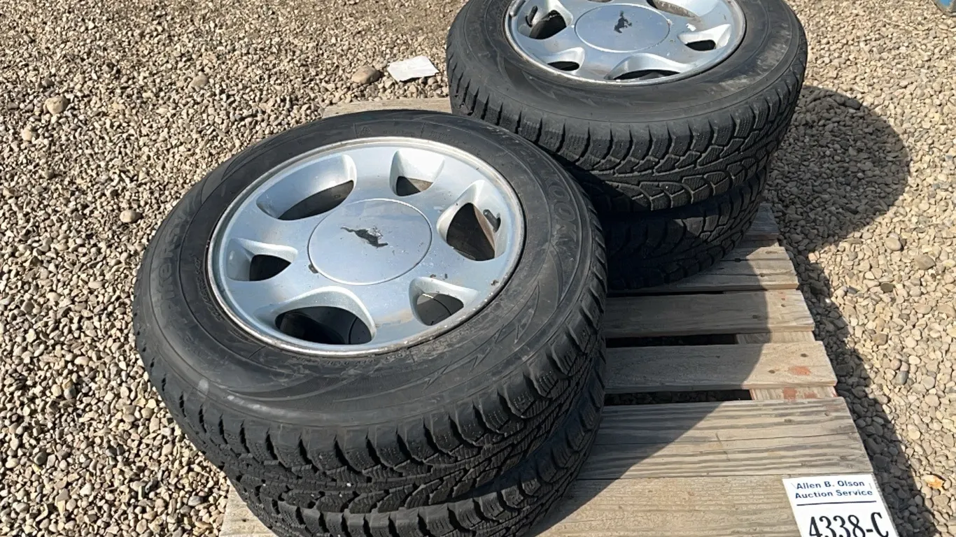 4 - HANKOOK 205/65 R15 TIRES ON RIMS - RIM VALUE ONLY