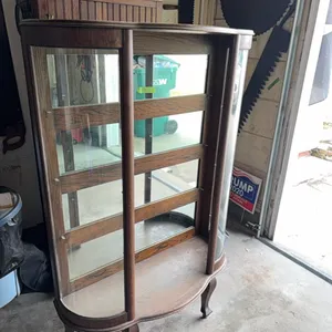 Curved glass china cabinet, complete, have shelves, door, etc.  buying complete cabinet