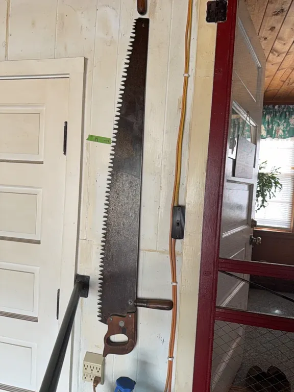 Antique saw, note top wood handle in excellent shape, buying one saw only