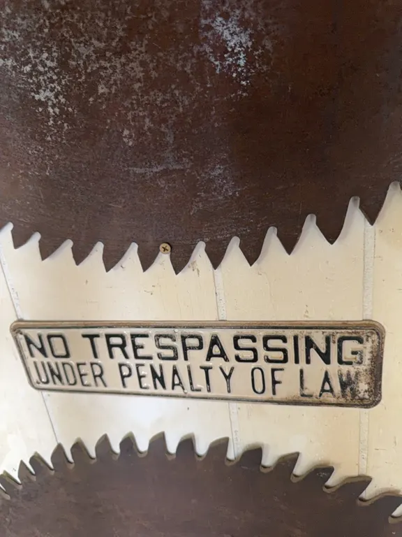 No trespassing sign, antique sign, “under penalty of law”