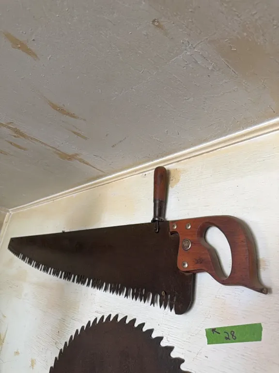 Very old saw with top wooden handle, nice shape