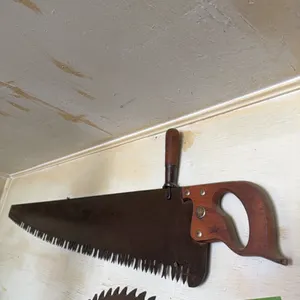 Very old saw with top wooden handle, nice shape