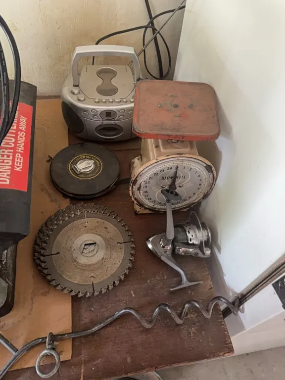 Misc., 100’ tape, saw blades, old scale, fishing reel, plus other.
