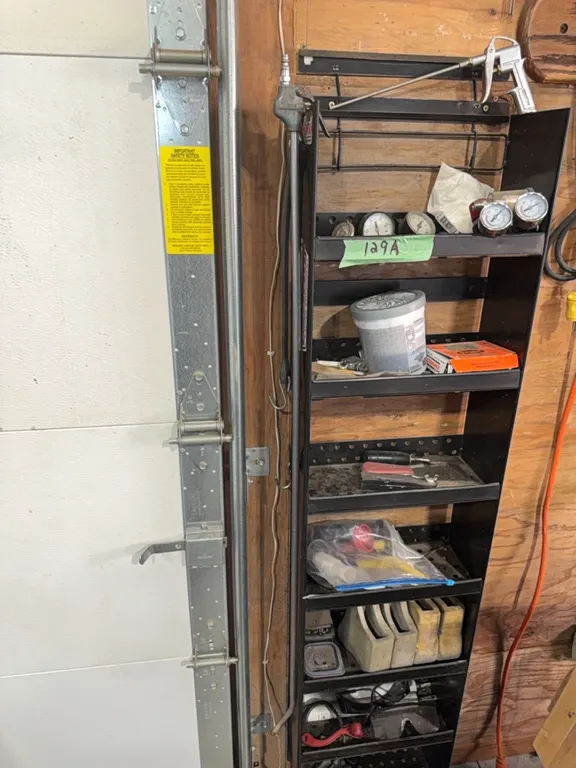 Wall shelf for garage, winning bidder gets everything on shelf as bonus