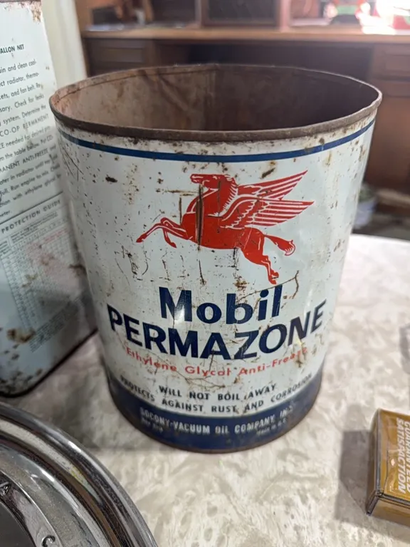 Pontiac hubcap, co-op antifreeze can, vintage mobile, can