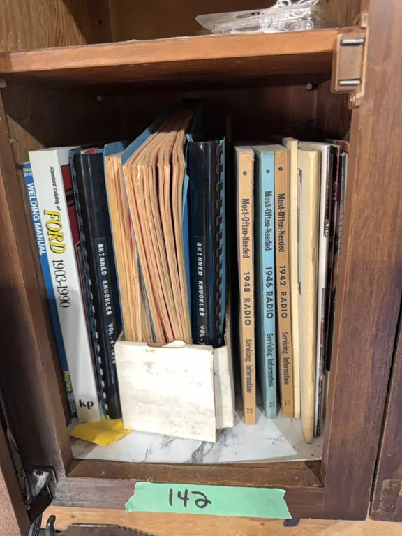Books- skinned knuckles car restoration books, most often needed servicing radio books 1946 1942 1948 etc includes extra miscellaneous see photos