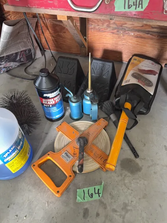 200 foot tape, oil cans, wheel chocks, car duster
