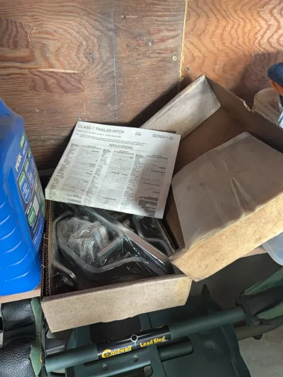 New car hitch, shop towels, straps, log chain, grease gun, pail, etc. see photos