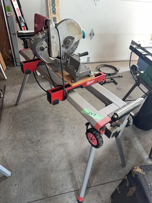 Commercial duty Milwaukee shop stand, excellent unit, equipped with top rollers, includes Makita miter saw