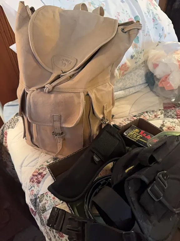 Backpack & box of holsters for knife, pistol, belt, frisbee and etc. and a liitle ammo