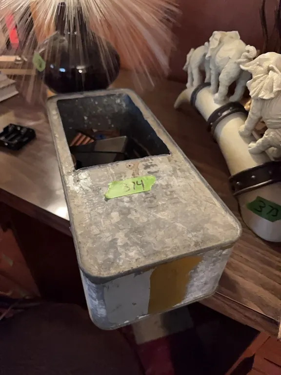 metal box with some rifle items and ammo