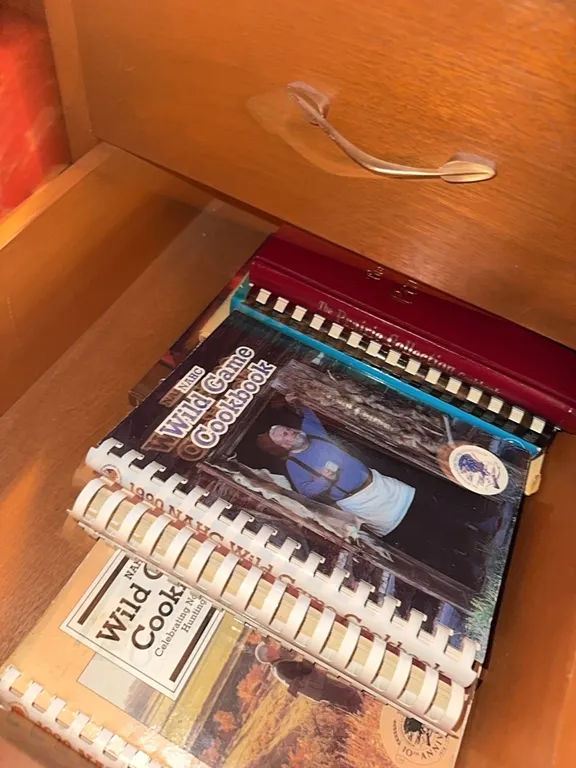 2 desk drawers- wild game cookbooks, and misc magazines