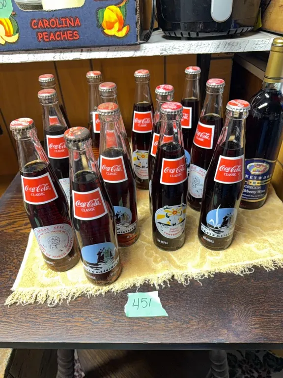 Coke bottles & 1 sealed bottle of wine