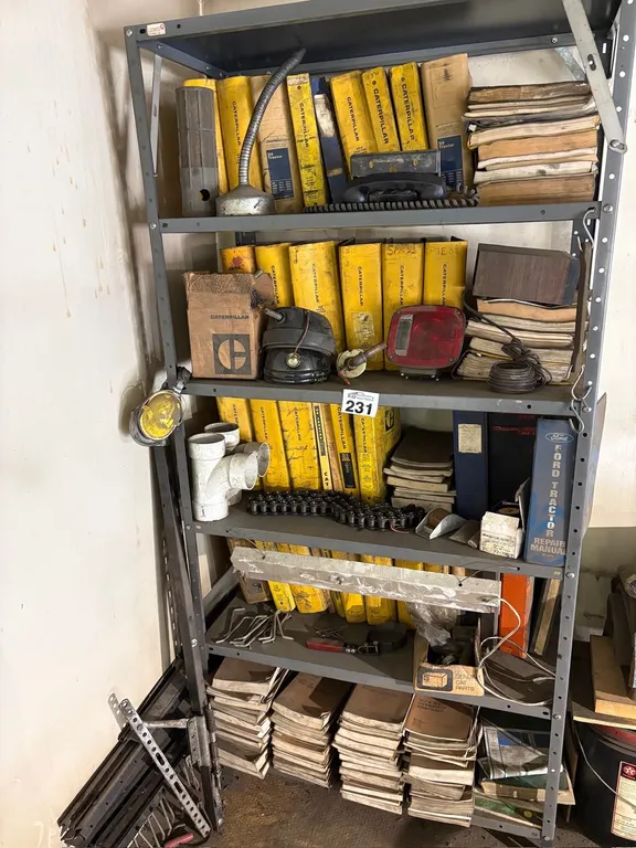 LARGE COLLECTION OF VINTAGE CATERPILLAR & FORD TRACTOR MANUALS, PARTS & METAL SHELVING UNIT