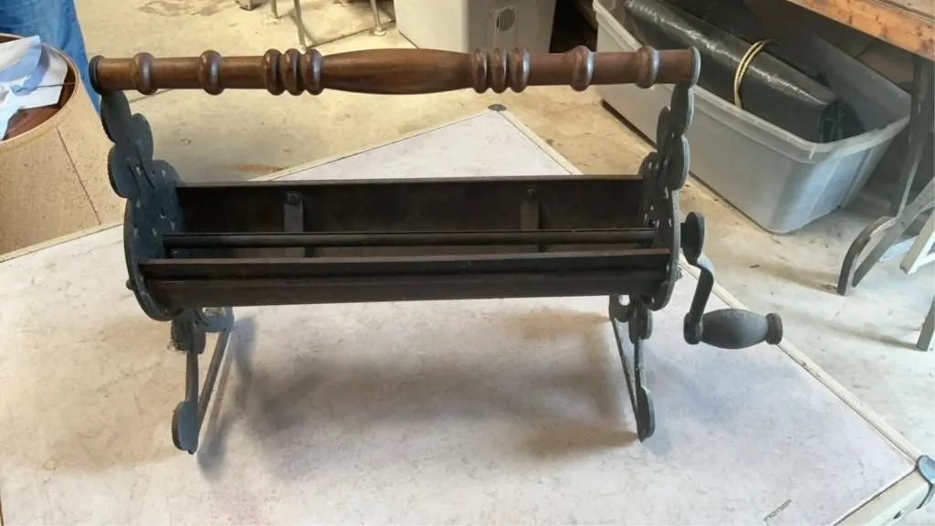Vintage cast newspaper log roller