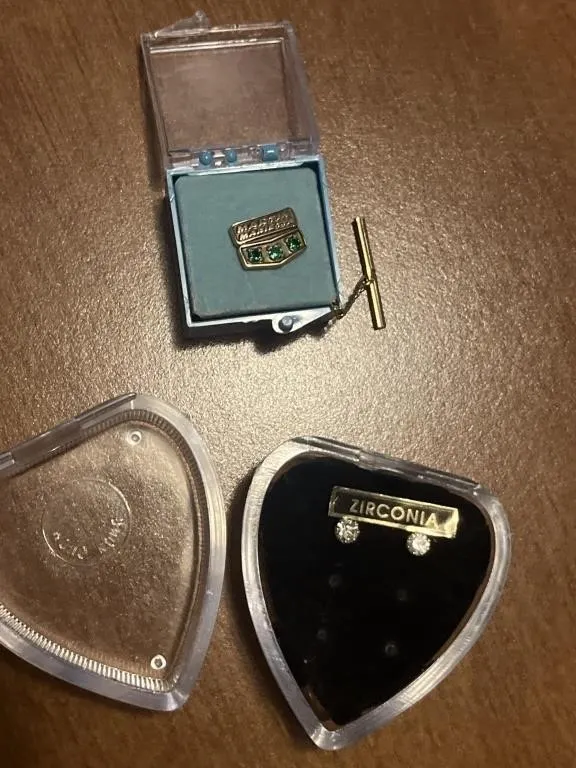 Cubic zirconia earrings and a 14k gold tie tack