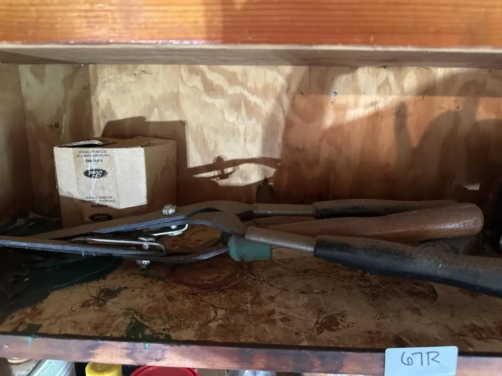 Shelf in cabinet in shed. Metal. Tin. Shears