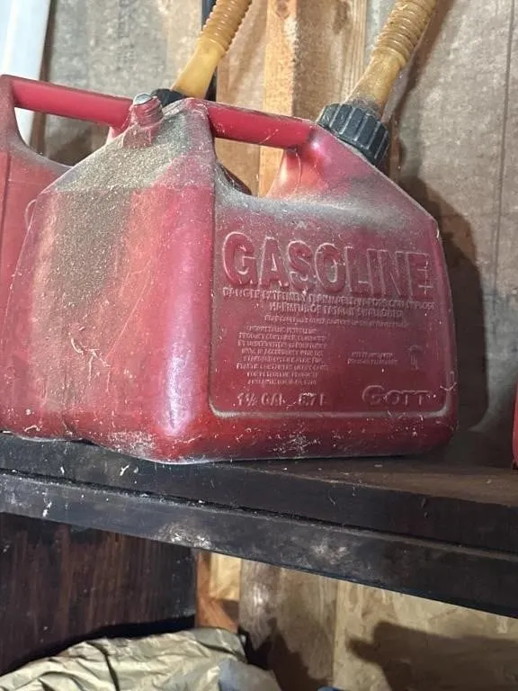 2-red plastic gas cans 1.5 and 2.5 ga