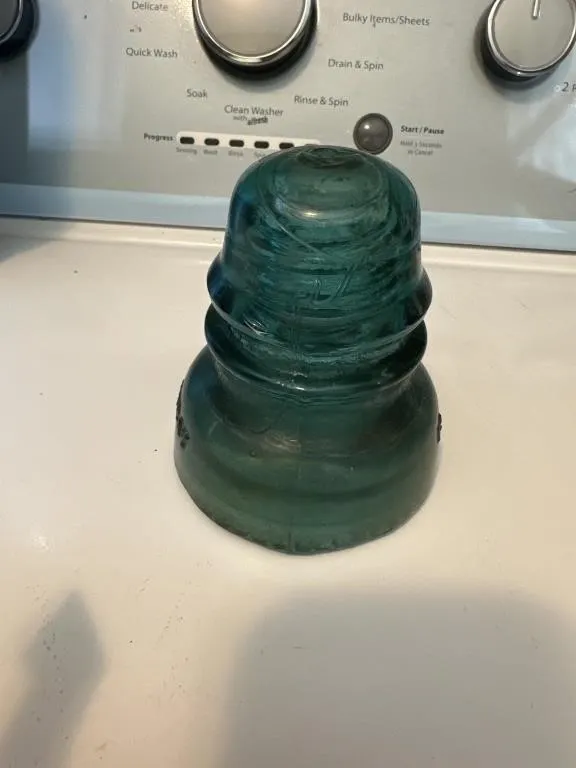 Gloves and antique teal Hemingray 42 glass
