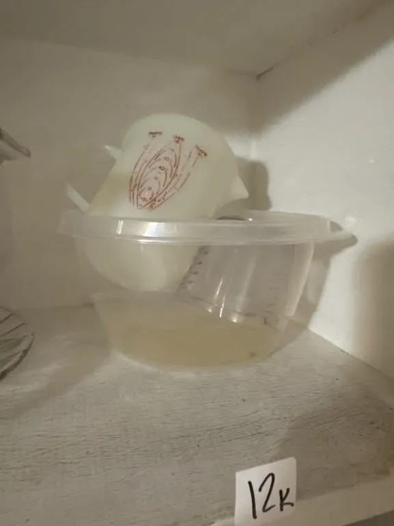 Plastic container. No lid. Measuring cups