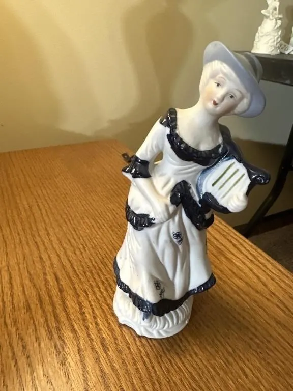 vintage blue and white porcelain figurine of a