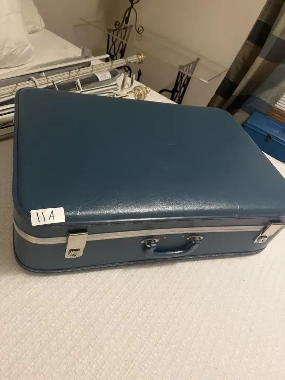 Blue rectangle hard suitcase is locked