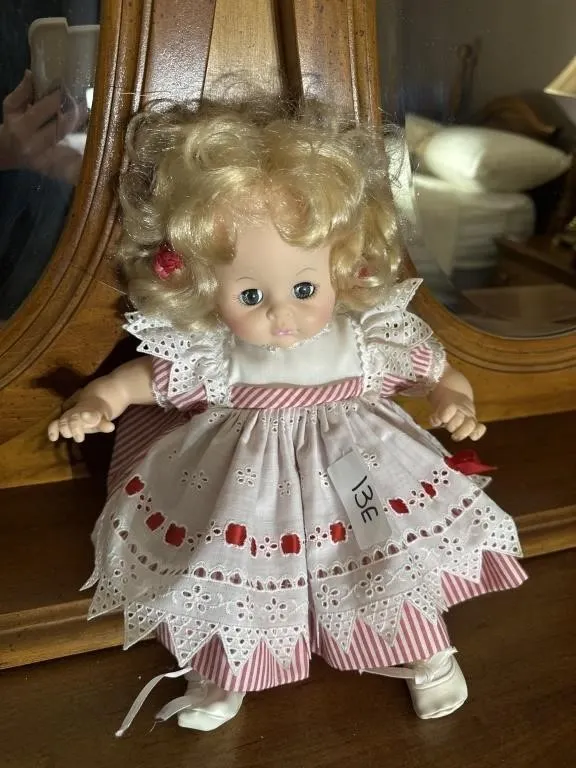 Baby doll with red and white striped dress