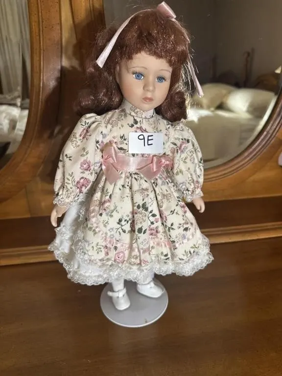 vintage porcelain Victorian doll features auburn
