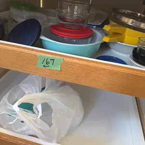 glass & plastic storage containers, 2 shelves on kitchen side of island