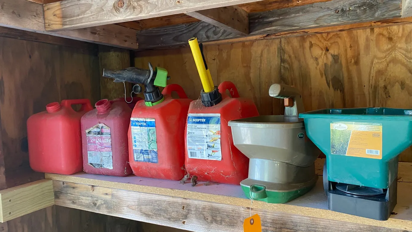 (4) Gas Cans and (2) Seed Spreaders