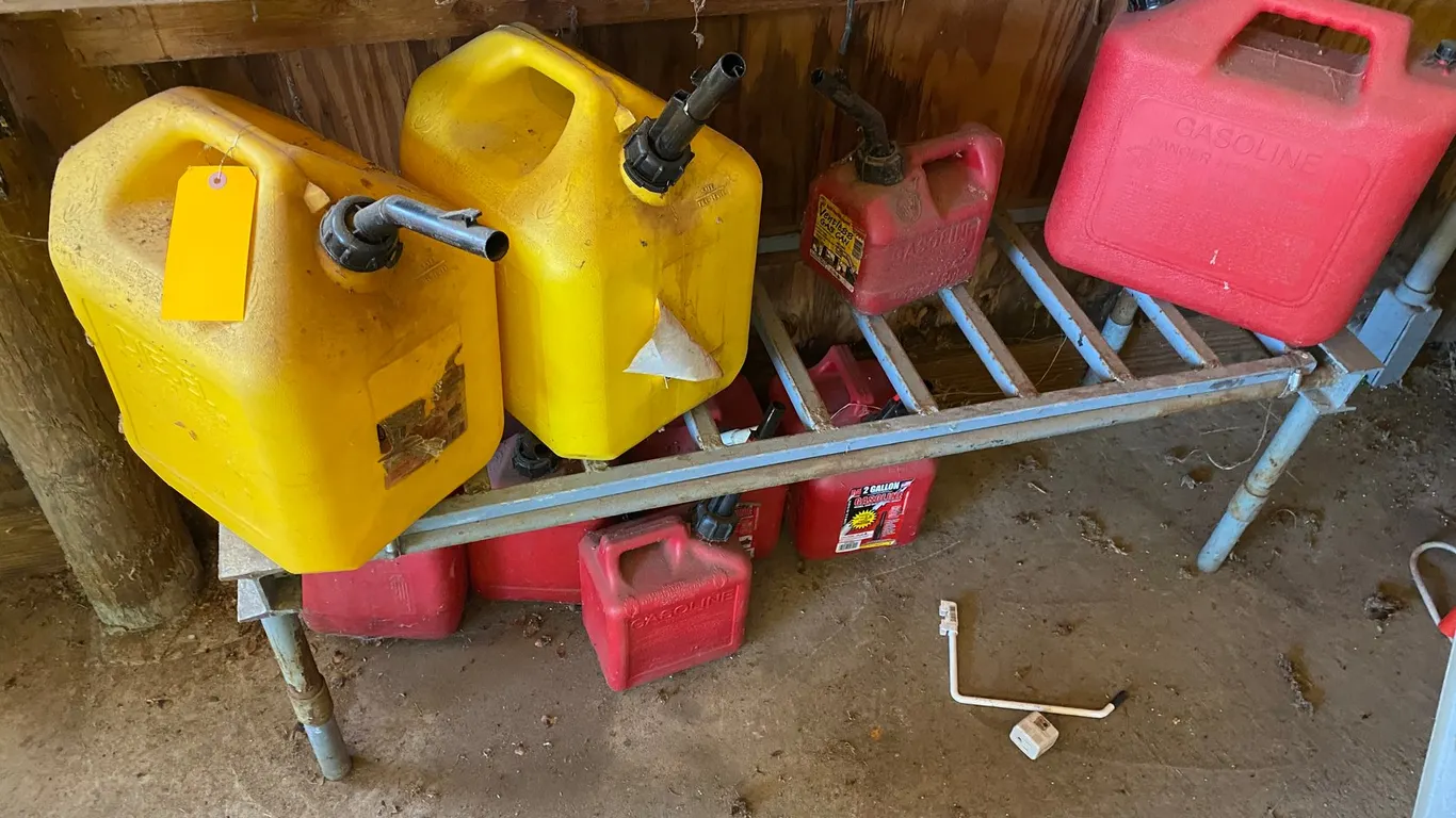 (9) Gas Cans and Metal Shelf