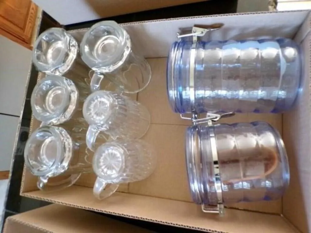 6-clear glass mugs and 2-plastic canisters
