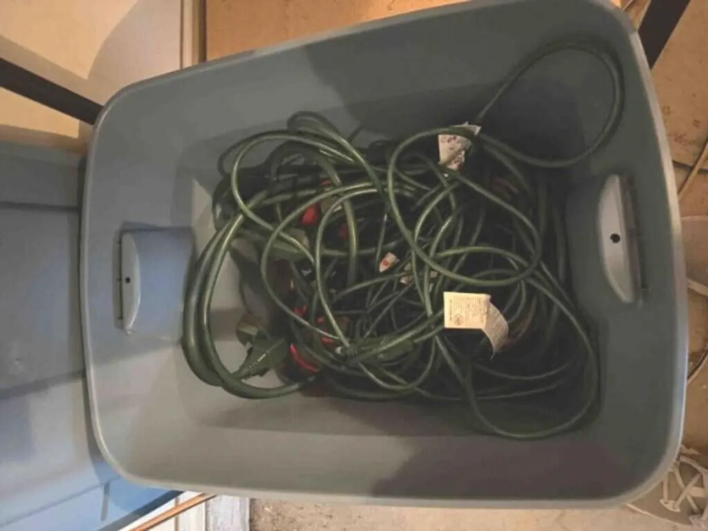 Tub of Christmas cords, extensions, etc