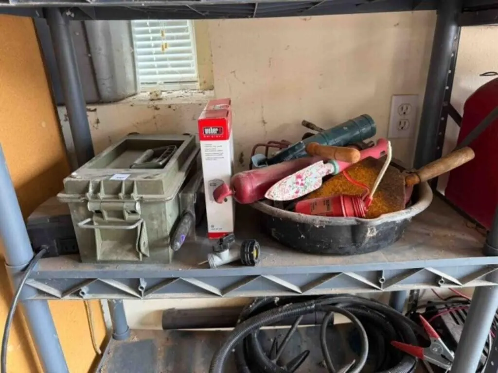 Contents of shelf, oil change pan, Weber grill