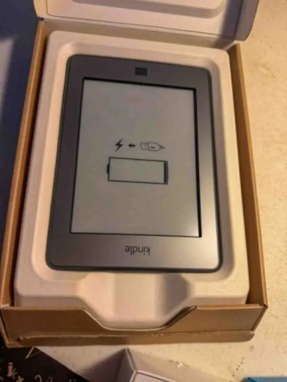 Kindle touch 3G in box & AT&T flip phone in box