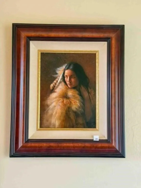 Native American woman draped in fox fur shawl