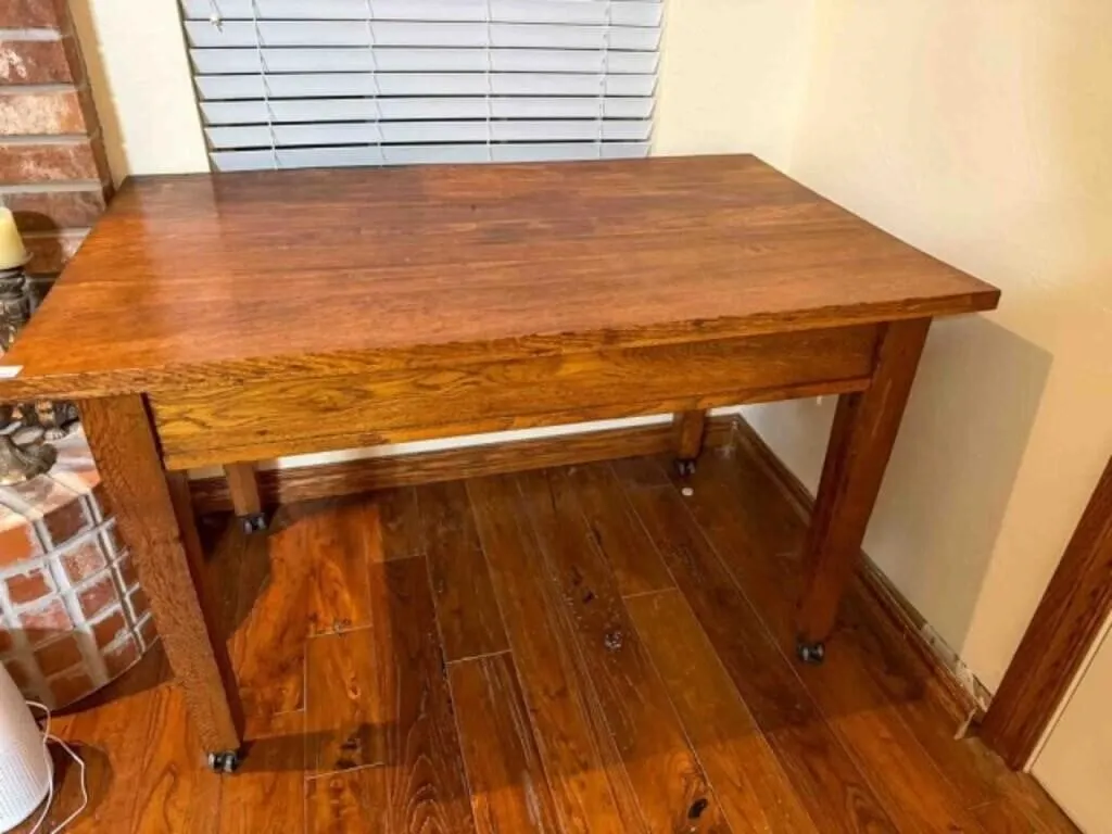 oak library table on steel rollers, 30" x 48"