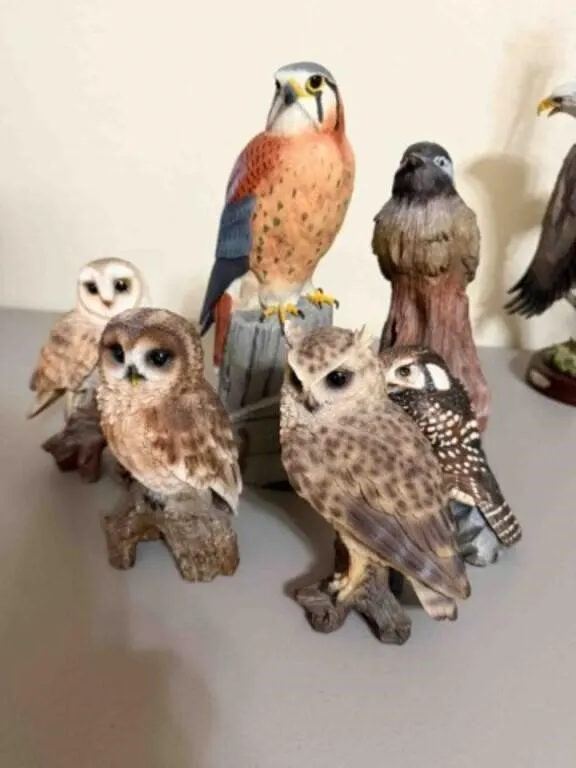 box of wood birds or prey