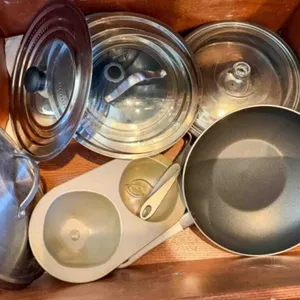drawer of misc. fry pans, 1 cast iron, grease