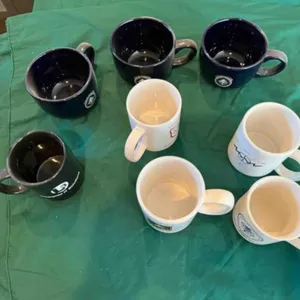 box of assorted coffee mugs