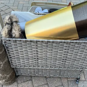 Woven clothing hamper and plastic storage tote with contents. Includes a rolling gray faux-wicker hamper with a fabric liner, a plastic storage tote, 